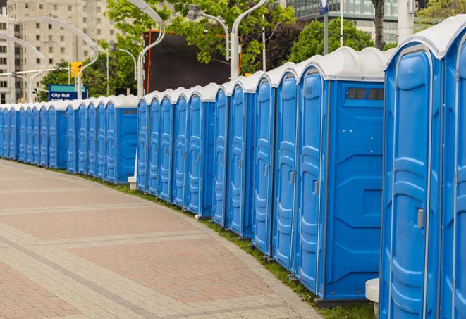 a fleet of portable restrooms ready for use at a large outdoor wedding or celebration in Crooked River Ranch